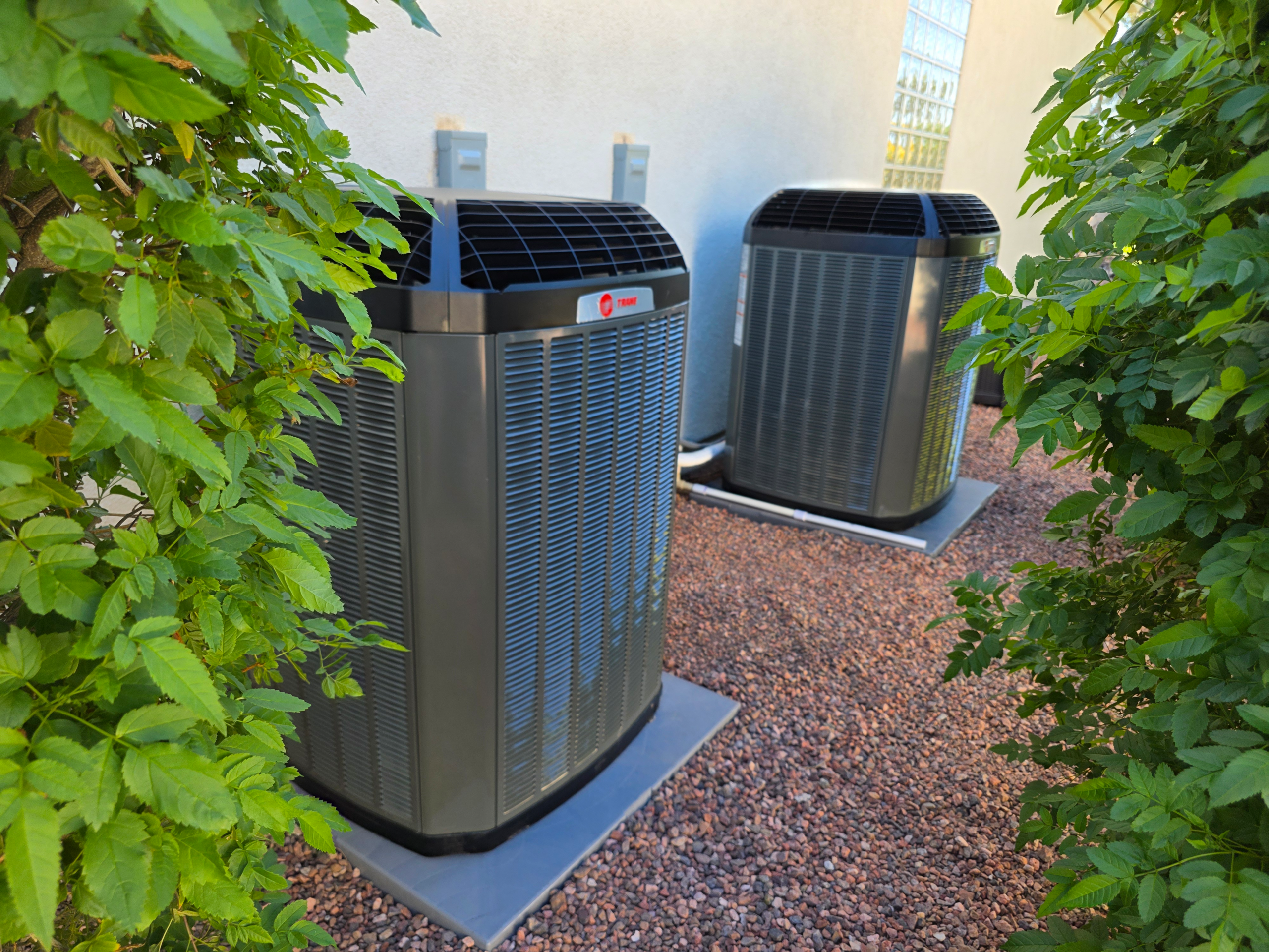 hvac units sitting outside a house
